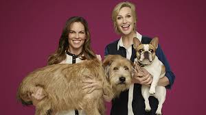 Hilary Swank and Jane Lynch with dogs