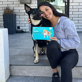 Girl and Dog with Embark DNA Test