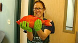 Girl holding giant goldfish