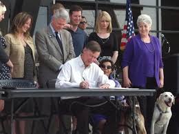 Governor John Hickenlooper signing bill