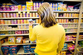 Woman Reading a Pet Food Label