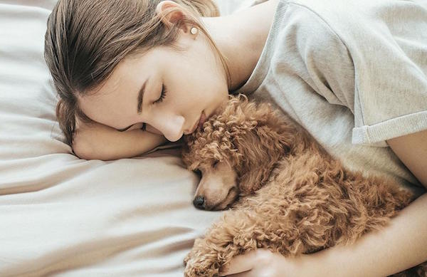Woman Sleeping With Dog
