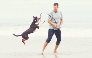 Rocky Kanaka with Dog at Beach